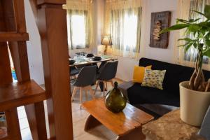a living room with a couch and a table at Blu Casa Del Mare in Monemvasia
