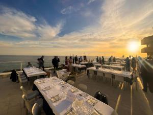 a group of tables on the deck of a cruise ship at Hotel Rex in Livorno