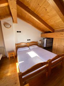 Posteľ alebo postele v izbe v ubytovaní Casa Fiemme Panchià