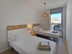 Posteľ alebo postele v izbe v ubytovaní Marina Real Apartments by NRAS