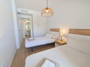 Posteľ alebo postele v izbe v ubytovaní Marina Real Apartments by NRAS