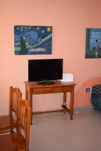 TV a/nebo společenská místnost v ubytování Casa Palmeras Costa