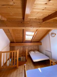 Posteľ alebo postele v izbe v ubytovaní Casa Fiemme Panchià