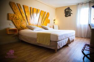 Postel nebo postele na pokoji v ubytování Hotel Les Grenadines