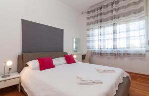 Posteľ alebo postele v izbe v ubytovaní Apartman Pegla