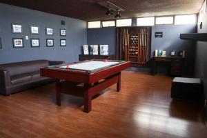 a room with a pool table and a couch at Utopía Hotel Boutique in Mexico City +70 photos