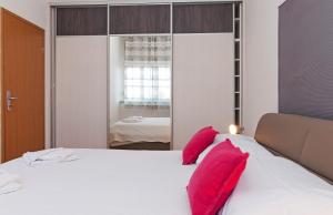 Posteľ alebo postele v izbe v ubytovaní Apartman Pegla