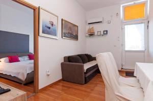Posteľ alebo postele v izbe v ubytovaní Apartman Pegla