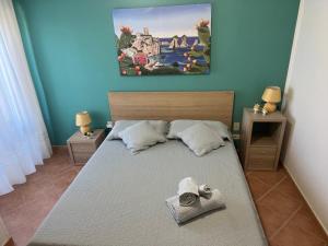 Posteľ alebo postele v izbe v ubytovaní Roseda Casa Vacanze