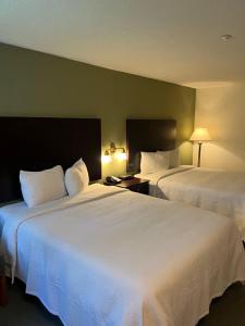 Voodi või voodid majutusasutuse The Grand Hotel Nanaimo toas