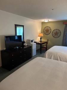 Voodi või voodid majutusasutuse The Grand Hotel Nanaimo toas