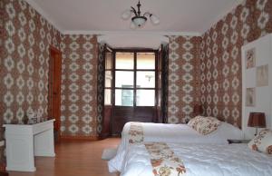 Postel nebo postele na pokoji v ubytování TRAVELER'S HOUSE QUITO