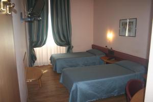 Voodi või voodid majutusasutuse Albert Hotel toas