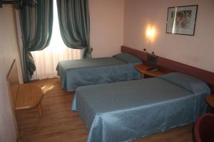 Voodi või voodid majutusasutuse Albert Hotel toas