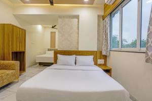 Voodi või voodid majutusasutuse Sai Sagar Lodging & Boarding toas