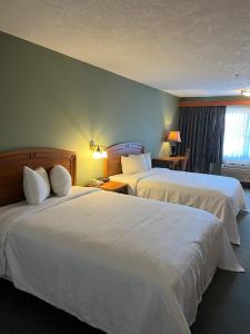 Voodi või voodid majutusasutuse The Grand Hotel Nanaimo toas
