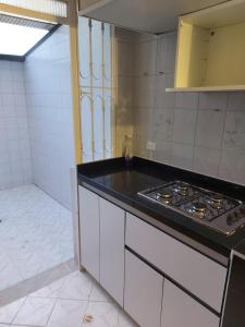 a kitchen with a stove and a counter top at Apartamento Luna 170 in Bogotá