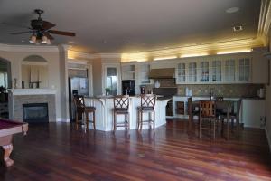 a kitchen with a table and chairs and a fireplace at 4BR LUXURY ENTERTAINMENT OASIS in Tracy