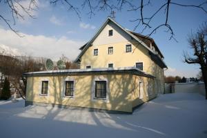 a house being built in the snow at Pichlhof Apartments - Comfort Near Planai in Schladming