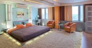 Postel nebo postele na pokoji v ubytování Premier Hotel Rus + 37 fotografií