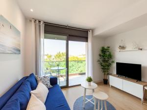 Televízia a/alebo spoločenská miestnosť v ubytovaní Belvilla by OYO Modern Apartment in Palamos