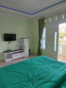 TV a/nebo společenská místnost v ubytování Shaima Homestay Syari'ah + 36 fotografií