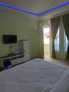 Postel nebo postele na pokoji v ubytování Shaima Homestay Syari'ah