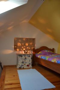 a bedroom with a bed and a white rug at Retiro da Lameira in Seia