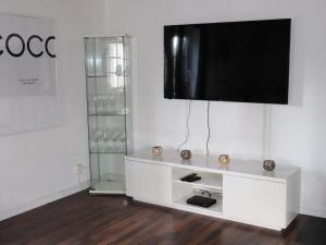 a white entertainment center with a television on a wall at 4 person holiday home in MUNKA-LJUNGBY-By Traum in Munka-Ljungby
