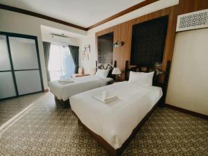 Baan Chao Khun Hotel客房内的一张或多张床位