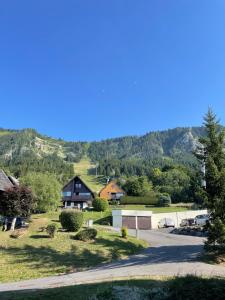 a view of a village with mountains in the background at Appartement typique de montagne in Thollon +9 photos