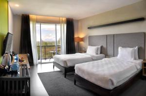 Voodi või voodid majutusasutuse The Balcone Suites & Resort toas