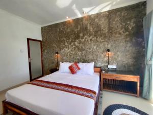 Una cama o camas en una habitación de Bali Yogi
