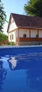 The swimming pool at or close to Kiscsermely Vendégház