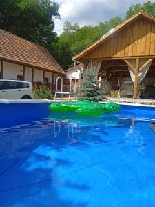 The swimming pool at or close to Kiscsermely Vendégház