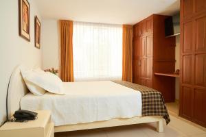 Postel nebo postele na pokoji v ubytování Astorga Hotel Arequipa