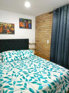 Cama o camas de una habitación en Apartamento Graffitour Comuna 13