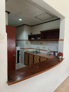 a kitchen with a sink and a counter in a room at A'Famosa Villa 884 in Kampong Alor Gajah