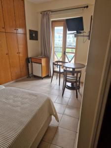 Postel nebo postele na pokoji v ubytování Y & P LATCHI HOTEL