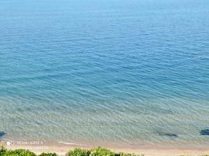 a view of the beach and the ocean at Sunset Apartment in Epanomi