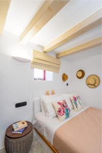 a bedroom with two beds and a table at Charming Cretan Villa near Sitia 