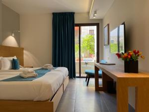 Postel nebo postele na pokoji v ubytování Majestic Byblos Grand Hotel
