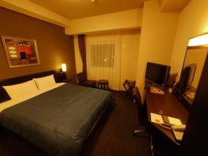 Ліжко або ліжка в номері Hotel Route-Inn Seki