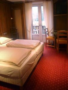 Postel nebo postele na pokoji v ubytování Logis Hôtel-Restaurant Auberge d'Imsthal