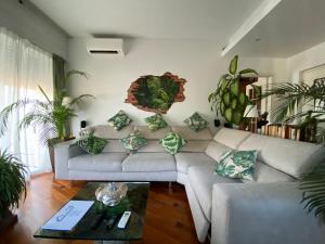 a living room with a couch and a table at Terrazza Milano Apartment in Milan