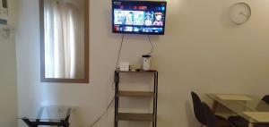A television and/or entertainment centre at Kdorzmoonwalk Kassel Residences Paranaque