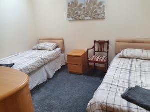 Uma cama ou camas num quarto em Nelson Street Apartment