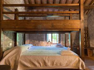 Voodi või voodid majutusasutuse Borgo Corniola B&B Naturista toas