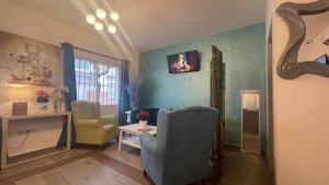 Telewizja i/lub zestaw kina domowego w obiekcie Hotel Boutique Andalucia