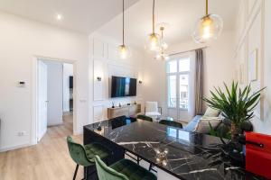 a living room with a couch and a table at Monaco frontière - Appartement Luxe - Belle Epoque - AD in Beausoleil